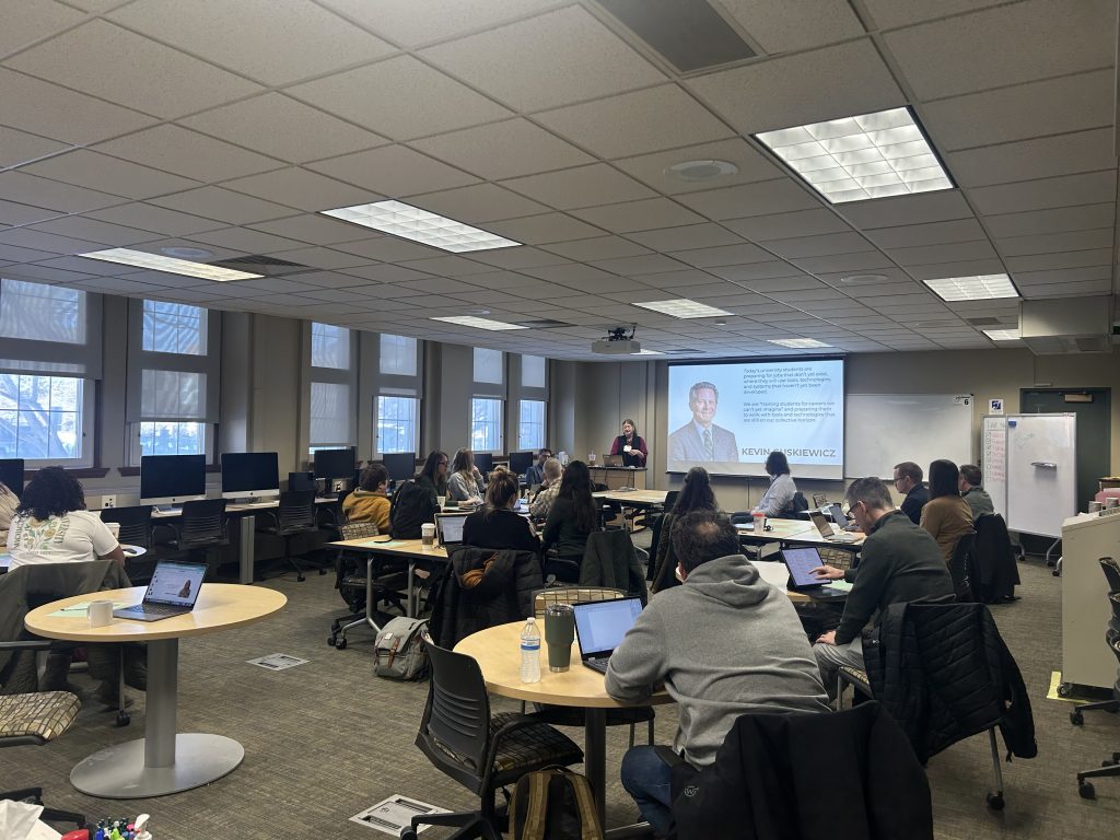 room full of people looking at projector screen